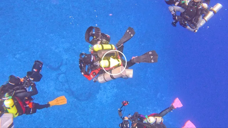 Scientists from the California Academy of Sciences enter the mouth of Blue Hole, a 330-foot-deep underwater sinkhole in Guam.