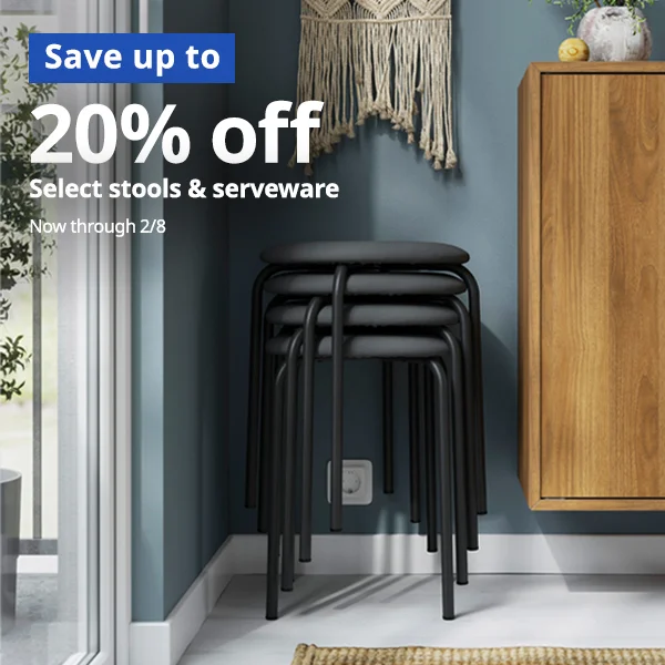 Black stools stacked on top of each other.