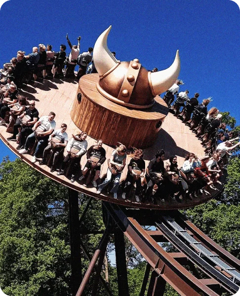 Image Description: Travelers having fun on a spinning theme park ride at Drayton Manor Resort in England