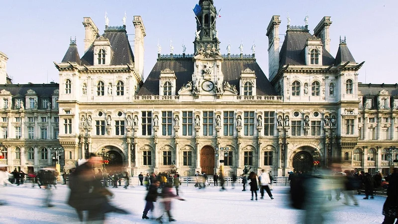 Image description: Ice skating at Hotel de Ville ice rink, Paris.