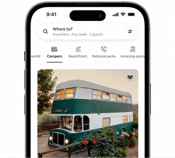 A phone with the Airbnb app open to a stay in the Campers Category. The filters menu pops up and a title says “Type of stay.” Above the title is a line drawing of a home sitting between apartment buildings. The screen scrolls down past types of homes like “Rooms,” and “Homes.” There’s a slider that allows you to adjust your price range and a series of buttons that let you pick the number of bedrooms, bathrooms, and more.