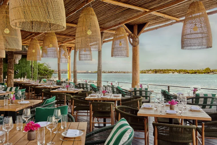 An ocean side, outdoor restaurant.